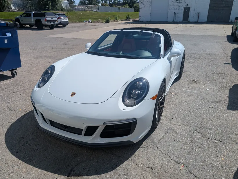 White Porsche Cayman after windshield replacement at Stealth garage